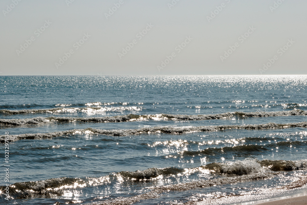 Sunstars reflecting off the relaxing waves of Lake Michigan from the overhead early March morning sun off the beach at Harrington Beach State Park, Belgium, Wisconsin Sunstars reflecting off the relaxing waves of Lake Michigan from the overhead early March morning sun off the beach at Harrington Beach State Park, Belgium, Wisconsin