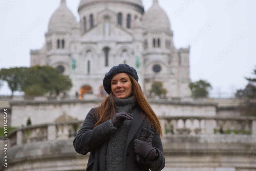 Smiling Beautiful Woman in Paris with Sacre Coeur Basilica in the Background Smiling Beautiful Woman in Paris with Sacre Coeur Basilica in the Background