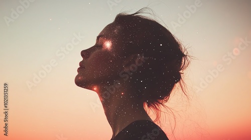 A serene profile of a woman against a stunning sunset, with a dreamy starry overlay, evoking a sense of wonder and tranquility.