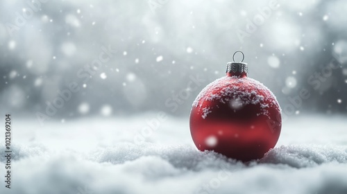 Empty christmas bauble over the winter, snowy background with copy space