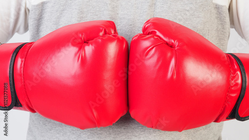 Hands wear red Boxing gloves on white background