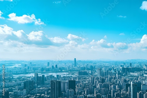 Aerial View of a City Skyline with Blue Sky and White Clouds