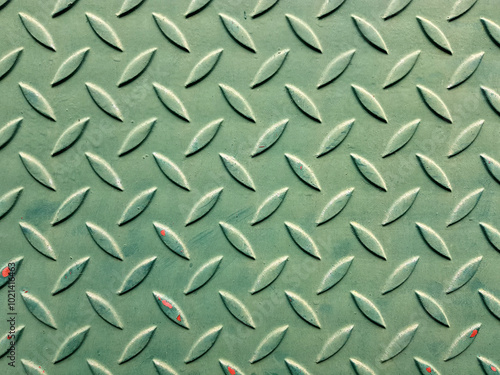 Metal steel plate with diagonal bumps of diamond pattern texture background.
