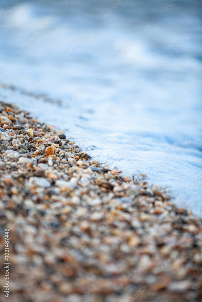 Background of wet stones on a beach surface near water . High quality photo Background of wet stones on a beach surface near water . High quality photo