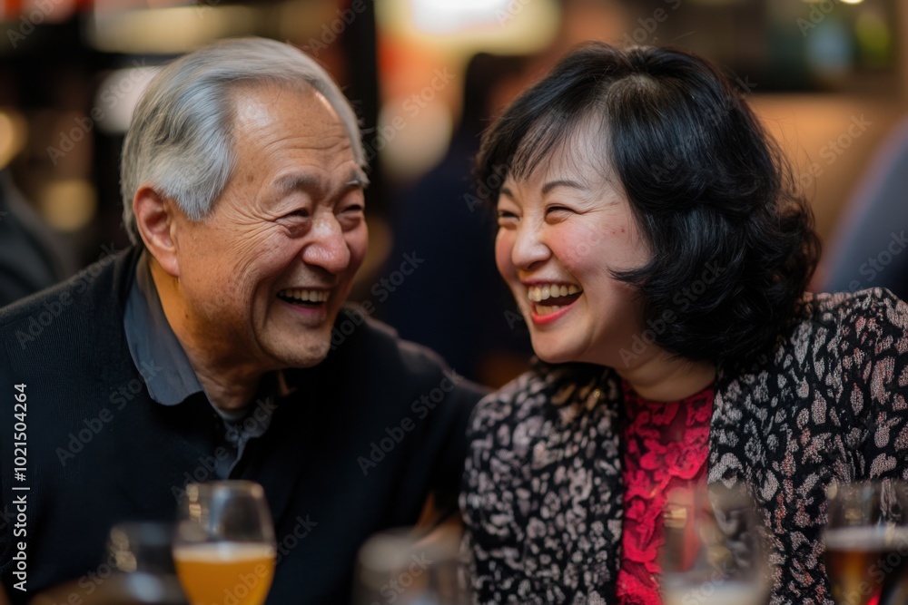 a man and a woman sitting next to each other at a table a man and a woman sitting next to each other at a table