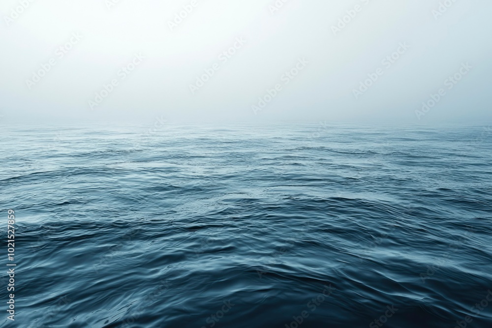 Fototapeta premium Calm Blue Ocean Water with Mist in the Distance