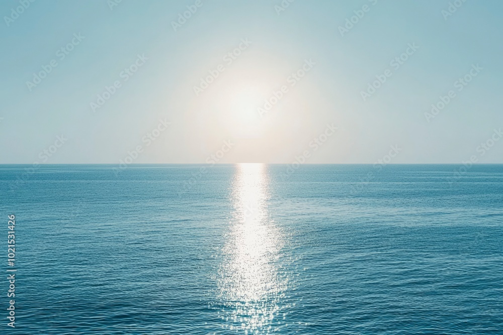 Obraz premium A Calm Ocean Surface with Sun Glare