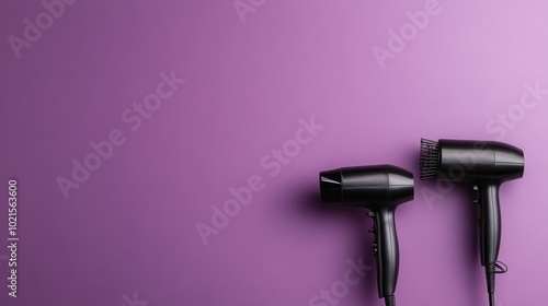 Two sleek black hairdryers rest against a vibrant purple backdrop, representing modernity in hair care tools, perfectly aligned in a minimalistic style setting. photo