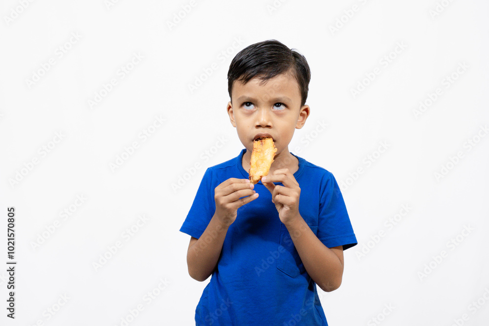 Cute and confident little boy standing while posing with a carrot, healthy lifestyle concept, isolated white background.
Cute and confident little boy standing while posing with a carrot, healthy lifestyle concept, isolated white background.