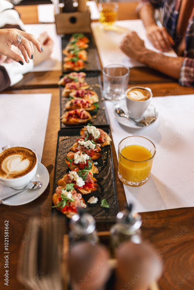 Canape served as appetizer on a gathering in a restaurant. Food and drink concept. Canape served as appetizer on a gathering in a restaurant. Food and drink concept.