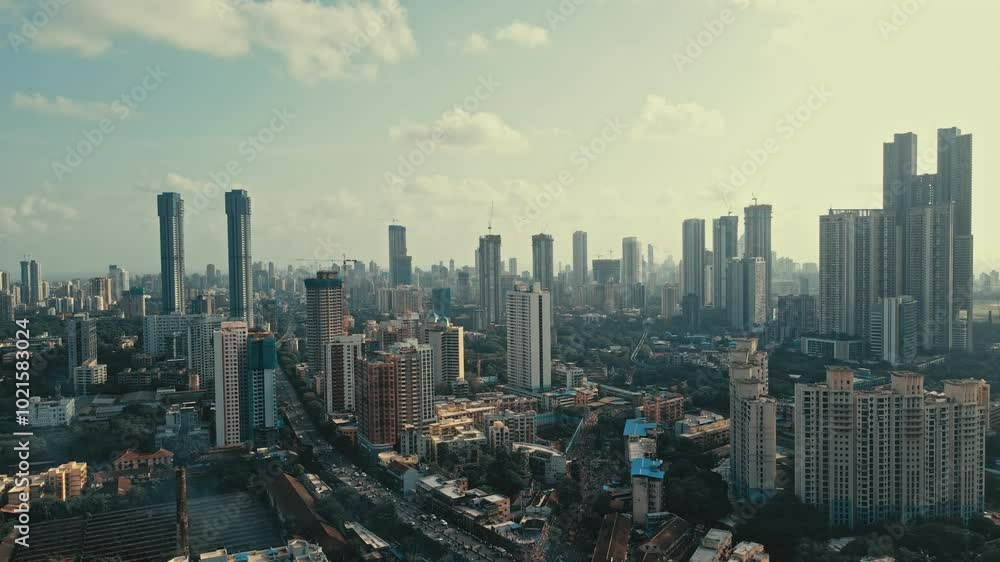 Cinematic aerial view of Mumbai city on a beautiful sunny and cloudy day during the monsoon season in Maharashtra, India. Cinematic aerial view of Mumbai city on a beautiful sunny and cloudy day during the monsoon season in Maharashtra, India.
