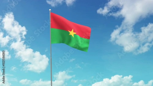 
The national flag of the republic of Burkina Faso flies in the blue sky. photo