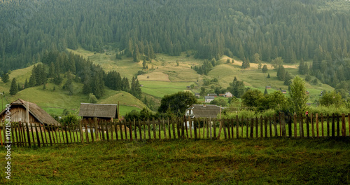 The Carpathians at the end of summer, agricultural lands and buildings in the...