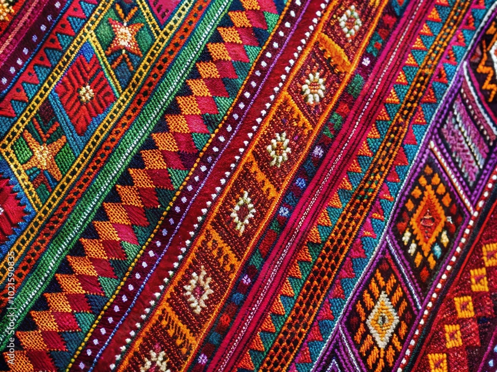 Obraz premium Traditional handwoven 'ewawa' fabric showcasing vibrant patterns and intricate craftsmanship details