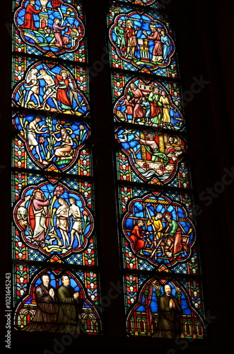 Vibrant Stained Glass Window Illustrating Biblical Stories in Brussels Cathedral 