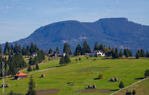 Landscape from a mountain village in the Carpathian mountains. Piatra Fantanele village - Tihuta pass - Romania photo