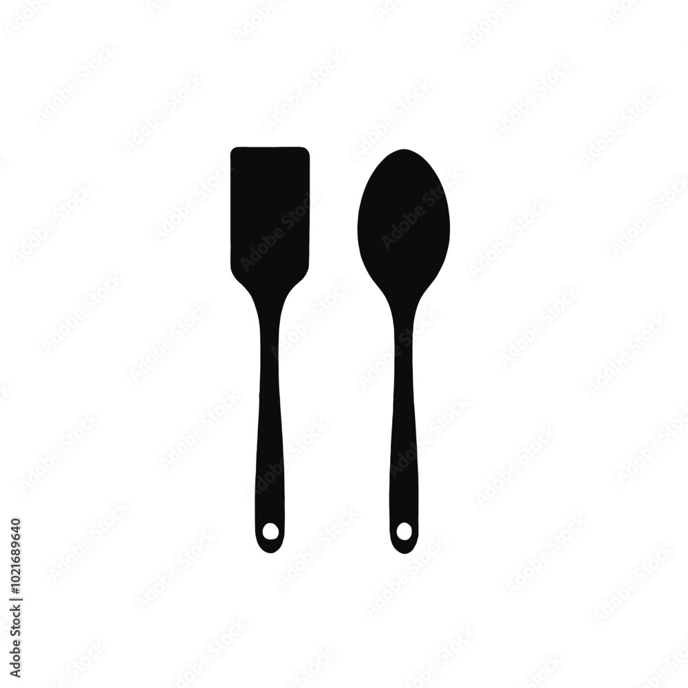Two black kitchen utensils, a spatula and a slotted spoon, on a white background Two black kitchen utensils, a spatula and a slotted spoon, on a white background