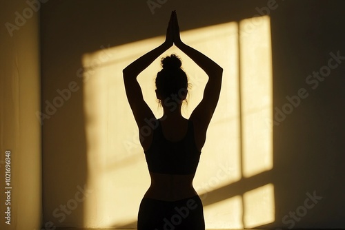 a woman is doing yoga in a dark room