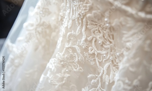 A white lace dress with pearls on it