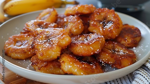 A plate of banana fritters, crispy and golden brown.