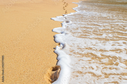 Footprints on the beautiful ocean sand. Set of pictures showing ocean waves in different stages over footprints. Cabo San Lucas. Mexico. photo