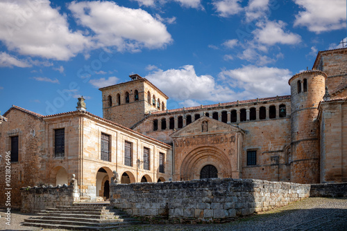 View of the impressive facade of the Romanesque collegiate church of Santa Juliana in Santillana del Mar, Cantabria, Spain