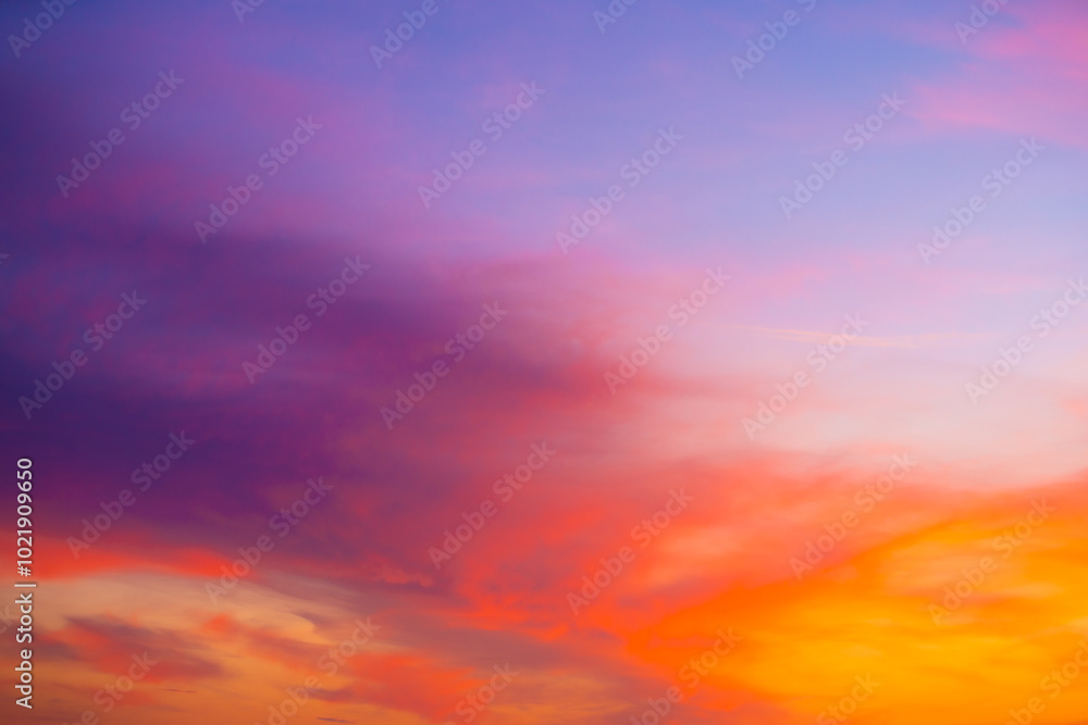 Fototapeta premium Beautiful sunset sky with amazing colorful clouds against deep blue