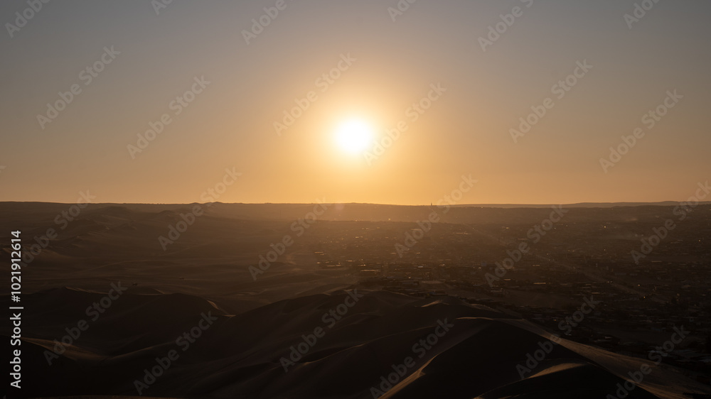 Immense Dune Landscape by the City of Ica, Peru at Sunset Facing the Sun Dramatically