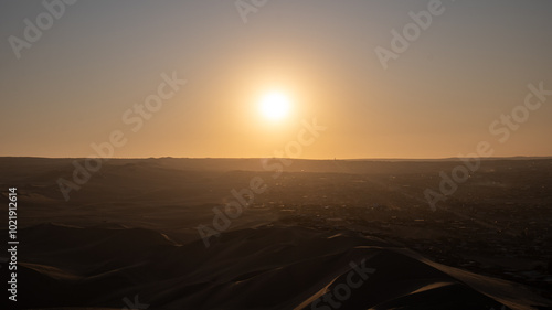 Obraz na płótnie Immense Dune Landscape by the City of Ica, Peru at Sunset Facing the Sun Dramatically w salonie