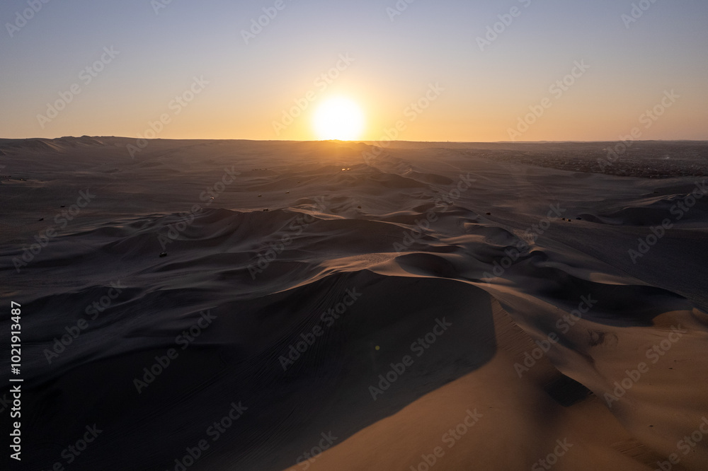 Immense Dune Landscape by the City of Ica, Peru at Sunset Facing the Sun Dramatically