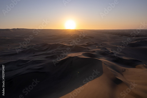 Obraz na płótnie Immense Dune Landscape by the City of Ica, Peru at Sunset Facing the Sun Dramatically w salonie