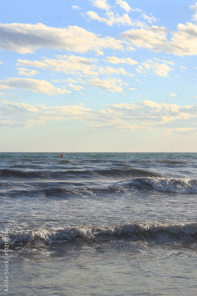 Sea view from the shore. Horizon on the sea. Balearic Sea, Salou, Spain. View of large waves on the sea from a low angle. Landscape. Stormy weather Sea view from the shore. Horizon on the sea. Balearic Sea, Salou, Spain. View of large waves on the sea from a low angle. Landscape. Stormy weather