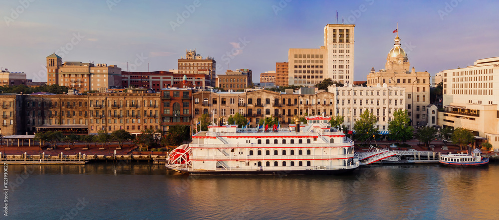 Fototapeta premium Ferry and Paddleboat steamship on the waterfront of the Savannah