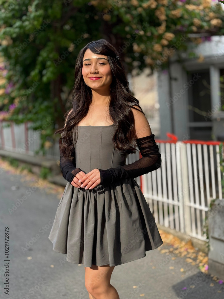Young, brunette, beautiful girl posing for the camera with different emotions and expressions, outdoors, in fashionable clothes. Beautiful facial expressions of the cute girl with her hands clasped Young, brunette, beautiful girl posing for the camera with different emotions and expressions, outdoors, in fashionable clothes. Beautiful facial expressions of the cute girl with her hands clasped