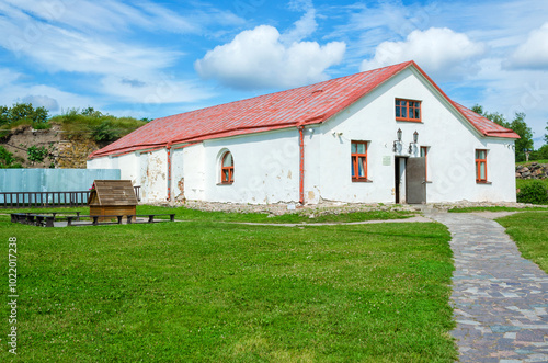 he building of the new arsenal in the courtyard of the Korela fortress in Priozersk, on a sunny summer day. photo