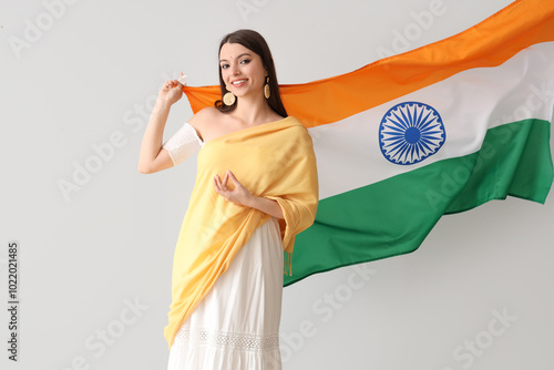 Young woman with Indian fla...