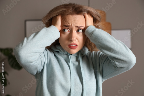 Young woman having panic at...