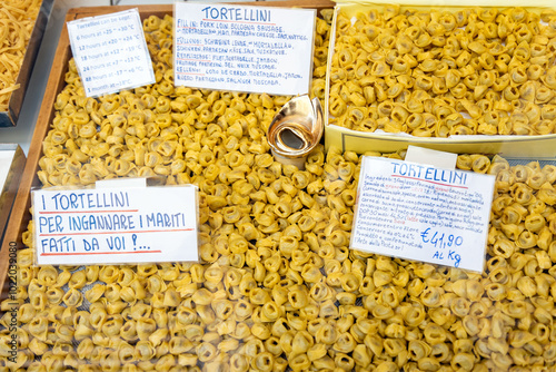 A variety of traditional Italian fresh tortellini on display in a local shop in Bologna, Italy