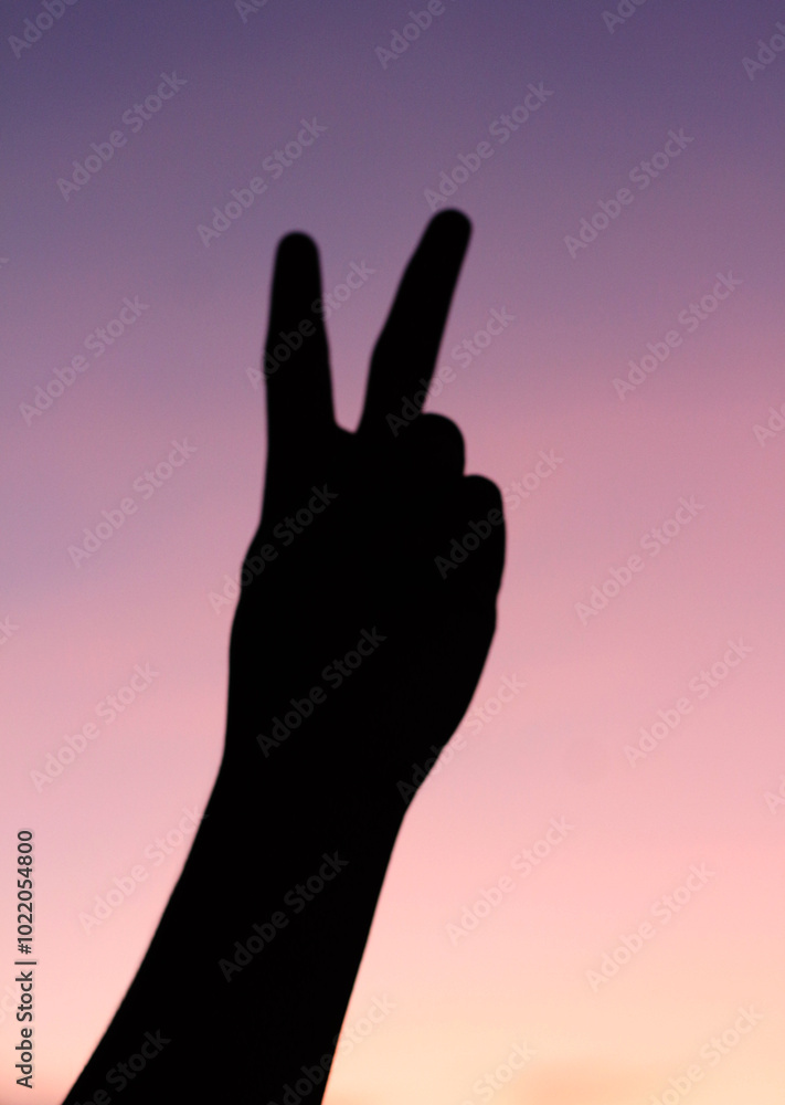 person with finger pointing at the sky sunset person with finger pointing at the sky sunset