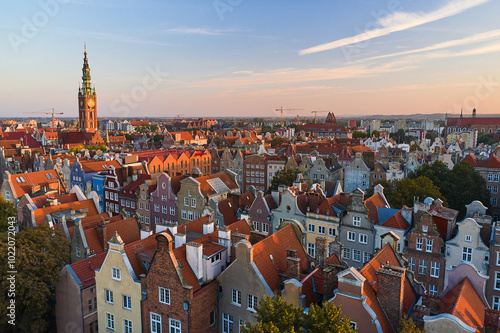 Traveling around beautiful city in Europe. Tiled rooftops of ancient city, aerial view photo