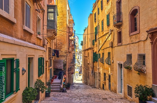 View of a Mediterranean alleyway in a historic old town on Malta.