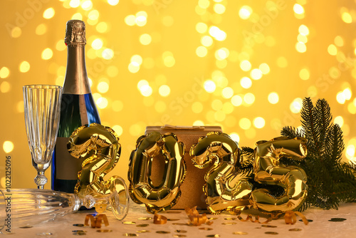 Bottle of champagne with gl...