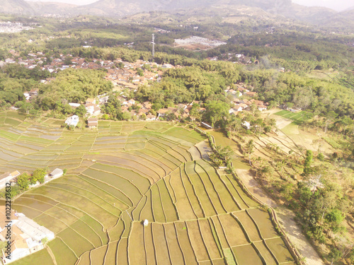 Natural view of Mount Pangradinan valley. The foot of the mountain is filled with residential areas, forests and rice fields. Mount Pangradinan is located in Cikancung, Bandung. Asia photo