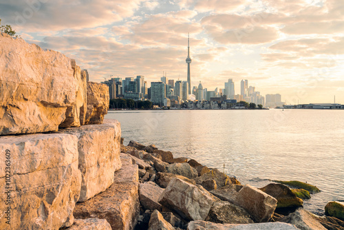 Downtown Toronto condos and buildings bathed in the glow of a sunrise