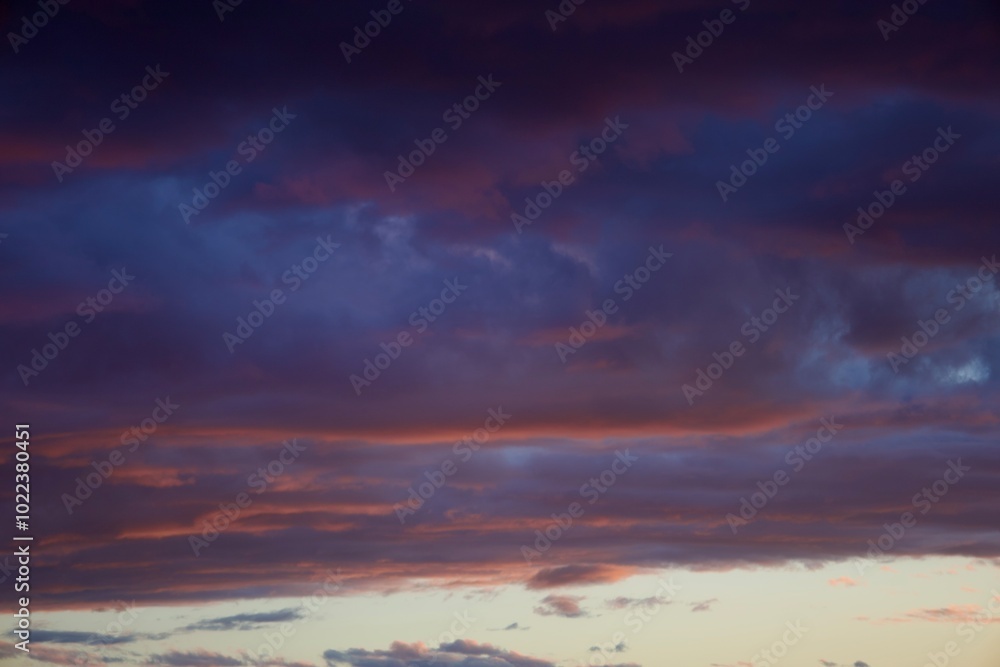 thick clouds in the sky with bluish and orange hues during sunset thick clouds in the sky with bluish and orange hues during sunset