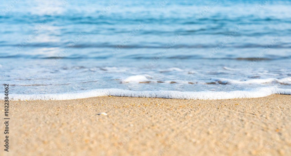 Summer beach with Sea blue ocean and foamy wave on sand,Banner of Peaceful natural tropical seascape with bright light,Seaside relaxing aerial beach scene with blurry waves splash in summer morning Summer beach with Sea blue ocean and foamy wave on sand,Banner of Peaceful natural tropical seascape with bright light,Seaside relaxing aerial beach scene with blurry waves splash in summer morning