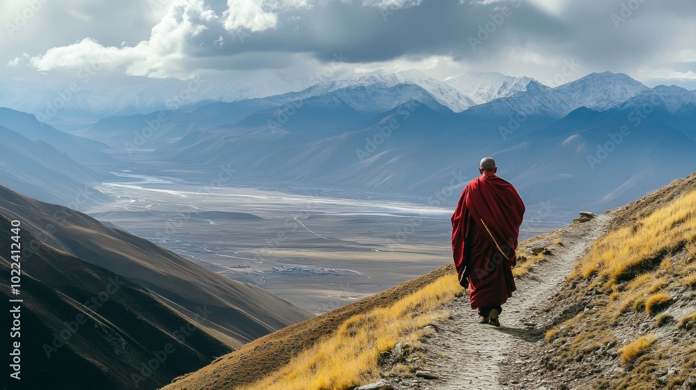 Fototapeta premium A Tibetan monk walking along a mountain path, prayer beads in hand, with the vast landscape of Tibet stretching out below