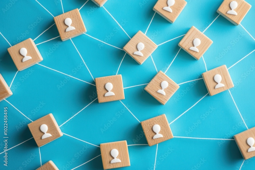 Network of Wooden Blocks with Person Symbols Connected by String on Blue Background Network of Wooden Blocks with Person Symbols Connected by String on Blue Background