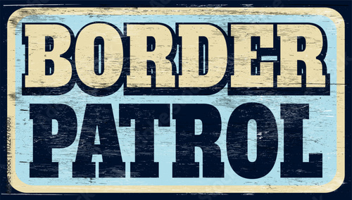 Aged retro border patrol sign on wood
