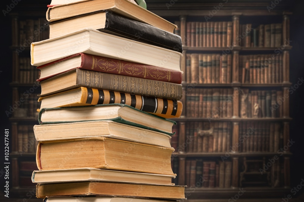 Stacks of old reading books on desk in library. Stacks of old reading books on desk in library.